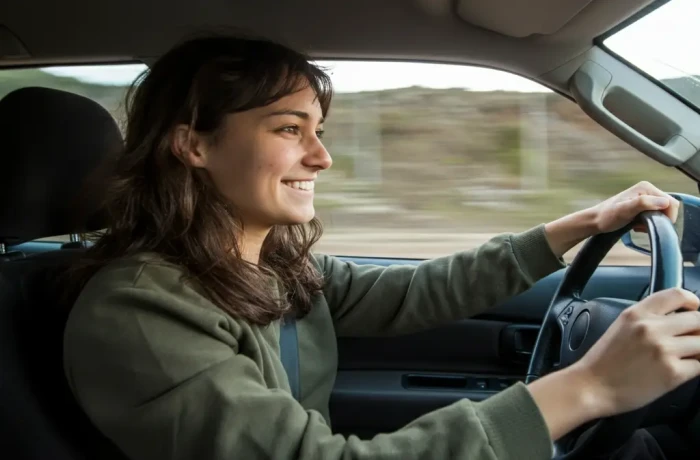 person driving a car webp